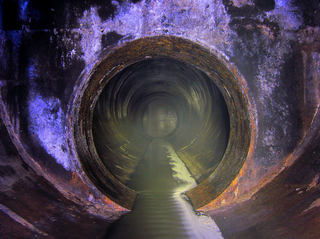 Illustration for article titled Unreal photographs of tunnels look like portals into the underworld